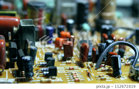 Different Electronic Parts On Computer Board Macro Shot  112672819