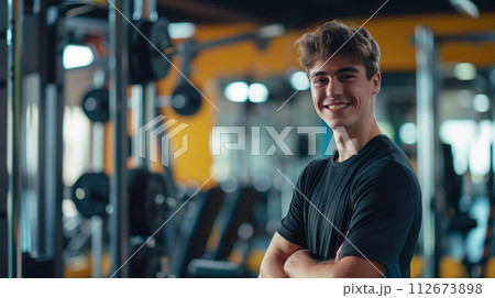Caucasian man in exercise clothes smiling confidently in the gym. 112673898