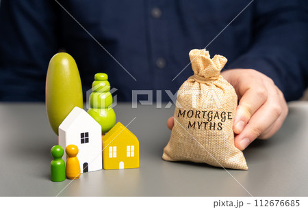 Mortgage myths concept. Misconceptions or misunderstandings about mortgages that can mislead borrowers. Real estate and loan concept. Money bag and miniature houses with family figures 112676685