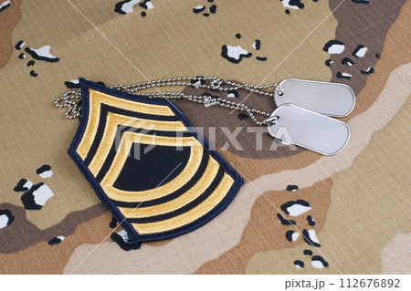 US ARMY Master Sergeant rank patch and dog tags on Desert Battle Dress Uniform US ARMY Master Sergeant rank patch and dog tags on Desert Battle Dress Uniform 112676892