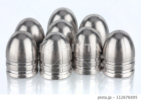 silver bullets for muzzle guns on white. silver bullets for muzzle guns on white. 112676895