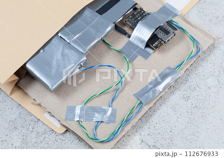 Mail bomb IED - Improvised Explosive Device with c4 and cell phone module in envelope Mail bomb IED - Improvised Explosive Device with c4 and cell phone module in envelope 112676933