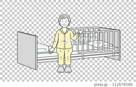 ベッドサイドに座るパジャマ姿の高齢女性と介護ベッド 112678580