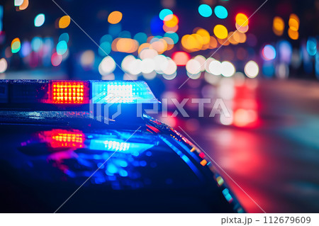AI-generated content. police car lights at night in city street with selective focus and bokeh 112679609