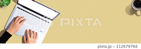 Person using a laptop computer Person using a laptop computer 112679768