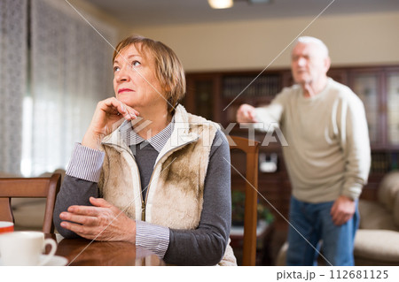 Senior man and woman quarreling at home 112681125
