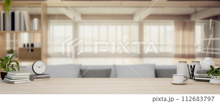 A space for displaying products on a wooden tabletop in a contemporary living room. A space for displaying products on a wooden tabletop in a contemporary living room. 112683797