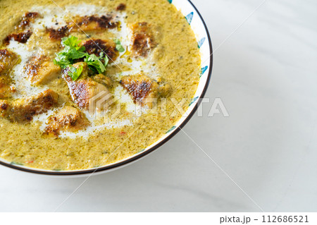 Afghani chicken in green curry or Hariyali tikka chicken hara masala Afghani chicken in green curry or Hariyali tikka chicken hara masala 112686521