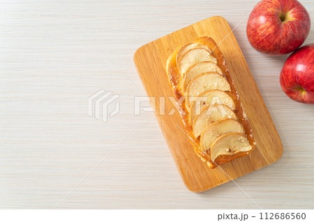 apple loaf crumbled on wood board apple loaf crumbled on wood board 112686560