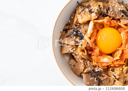 pork bulgogi rice bowl with kimchi and Korean pickled egg pork bulgogi rice bowl with kimchi and Korean pickled egg 112686608