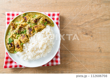 Afghani chicken in green curry or Hariyali tikka chicken hara masala with rice Afghani chicken in green curry or Hariyali tikka chicken hara masala with rice 112686708