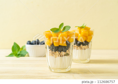 homemade mango and blueberry with yogurt and granola 112686757