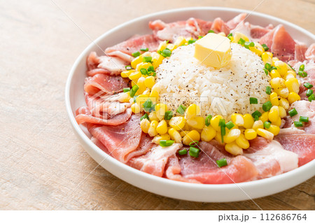fresh pork raw sliced with rice and corn on plate and ready to cook 112686764