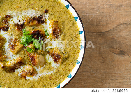Afghani chicken in green curry or Hariyali tikka chicken hara masala Afghani chicken in green curry or Hariyali tikka chicken hara masala 112686953