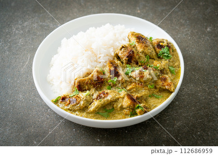 Afghani chicken in green curry or Hariyali tikka chicken hara masala with rice Afghani chicken in green curry or Hariyali tikka chicken hara masala with rice 112686959