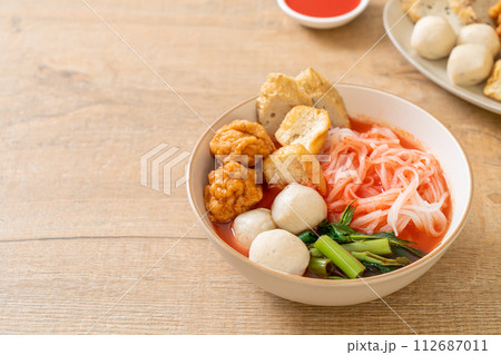 small flat rice noodles with fish balls and shrimp balls in pink soup, Yen Ta Four or Yen Ta Fo 112687011