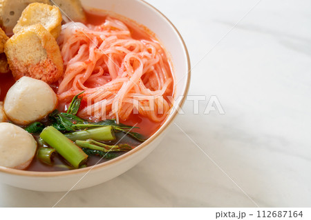 small flat rice noodles with fish balls and shrimp balls in pink soup, Yen Ta Four or Yen Ta Fo small flat rice noodles with fish balls and shrimp balls in pink soup, Yen Ta Four or Yen Ta Fo 112687164