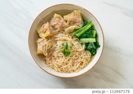 egg noodles with pork wonton soup or pork dumplings soup and vegetable egg noodles with pork wonton soup or pork dumplings soup and vegetable 112687178