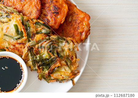 Pajeon or Korean pancake and Korean Kimchi pancake or Kimchijeon on white background Pajeon or Korean pancake and Korean Kimchi pancake or Kimchijeon on white background 112687180