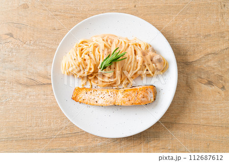 grilled salmon with spaghetti creamy tomato sauce grilled salmon with spaghetti creamy tomato sauce 112687612