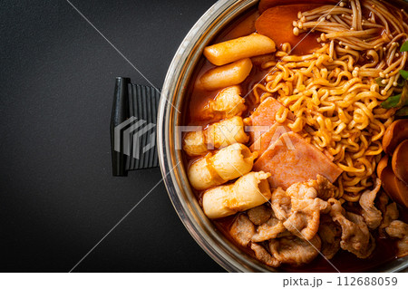 Budae Jjigae or Budaejjigae (Army stew or Army base stew). It is loaded with Kimchi, spam, sausages, ramen noodles and much more Budae Jjigae or Budaejjigae (Army stew or Army base stew). It is loaded with Kimchi, spam, sausages, ramen noodles and much more 112688059