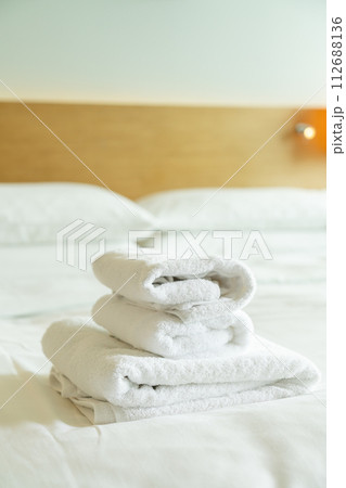 close-up white towel on bed 112688136
