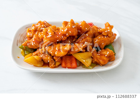 fried crispy chicken with sweet and sour sauce 112688337