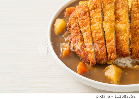 curry rice with fried pork cutlet and creamy omelet curry rice with fried pork cutlet and creamy omelet 112688358