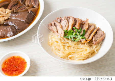 dried noodles with stewed duck in white bowl dried noodles with stewed duck in white bowl 112688503