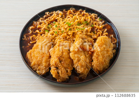 Korean instant noodles with fried chicken or Fried chicken ramyeon Korean instant noodles with fried chicken or Fried chicken ramyeon 112688635