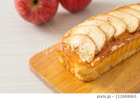 apple loaf crumbled on wood board 112688663