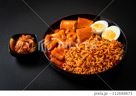 Korean instant noodles with Korean rice cake and fish cake and boiled egg 112688671