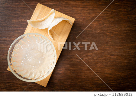 Edible bird's nest soup in glass bowl 112689012