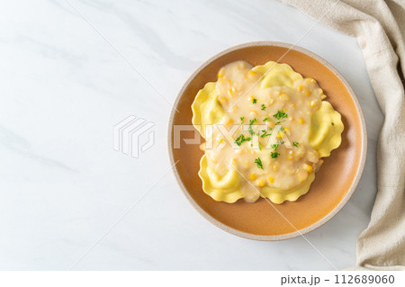 ravioli pasta with corn cheese sauce 112689060