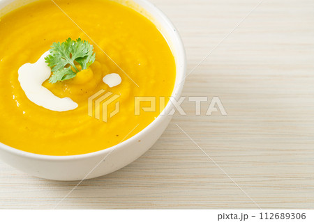 pumpkin soup in white bowl 112689306