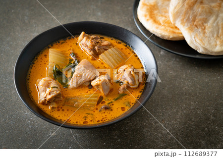 Chicken curry soup with roti Chicken curry soup with roti 112689377