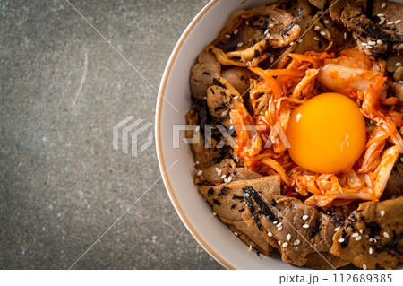 pork bulgogi rice bowl with kimchi and Korean pickled egg pork bulgogi rice bowl with kimchi and Korean pickled egg 112689385