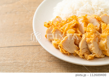 fried chicken topped rice with dipping sauce fried chicken topped rice with dipping sauce 112689400