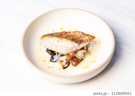 grilled Barramundi steak with mushroom sauce 112689501