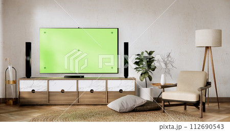 Smart Tv Mockup with blank green screen hanging in modern white empty room interior minimal designs. Smart Tv Mockup with blank green screen hanging in modern white empty room interior minimal designs. 112690543