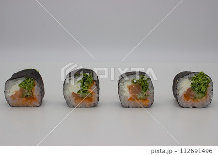 Assorted Sushi Rolls on White Background Assorted Sushi Rolls on White Background 112691496