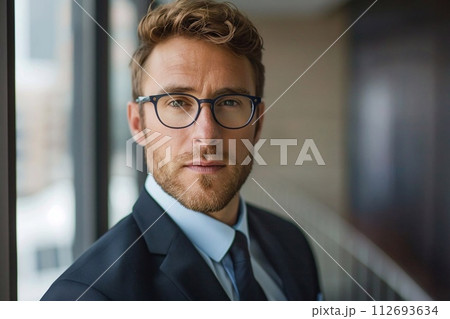 35 year old business man profile picture with glasses in a office 112693634