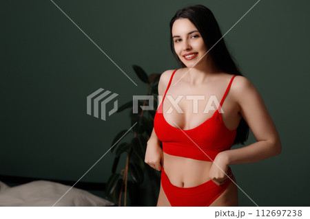 Beauty and fashion . Sexy brunette model on bed Beauty and fashion . Sexy brunette model on bed 112697238