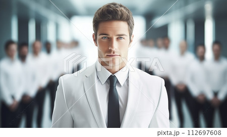 Businessman stands with team, epitomizing collaborative leadership 112697608