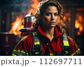 AI-generated content. Young Female Firefighter with Fire Extinguisher during Fire Incident 112697711