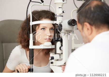 looking into eye test machine looking into eye test machine 112698221
