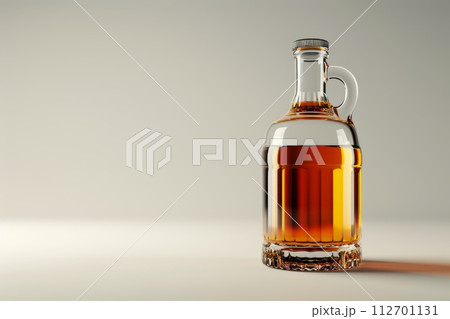 Bottle of premium alcohol, amber color, isolated on white background. A bottle Of Whiskey. A bottle of elite alcohol in amber color, highlighted on a white background 112701131