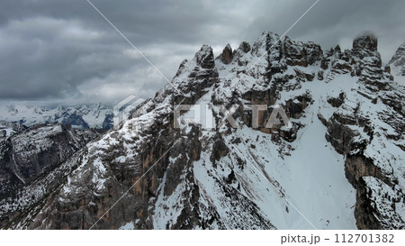Rocky snow mountains and clouds Rocky snow mountains and clouds 112701382