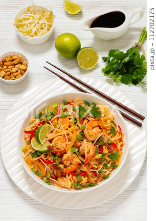 pad thai with shrimps, peanuts, eggs, bean sprouts 112702175