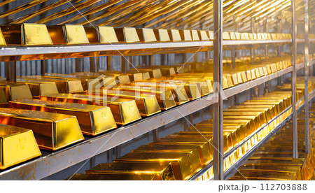 Many gold bars were placed on the iron shelves In the bank vault 112703888